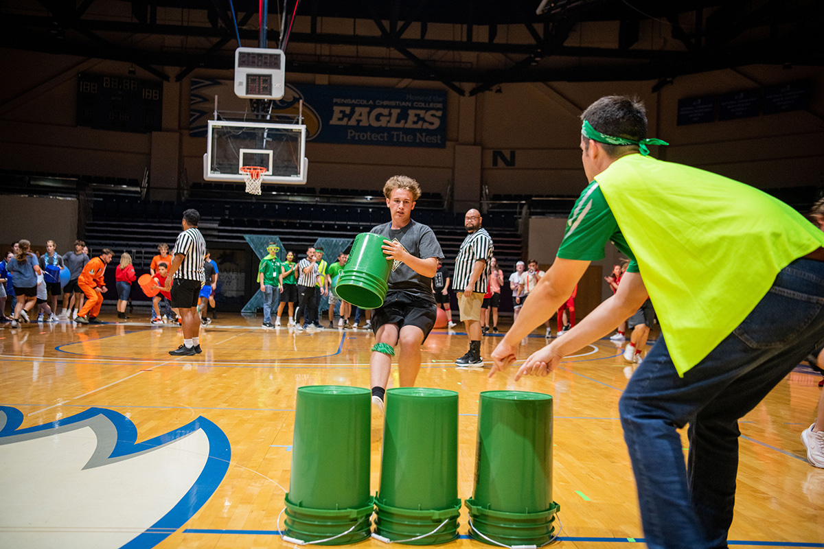 Teen Extreme green team playing bucket game