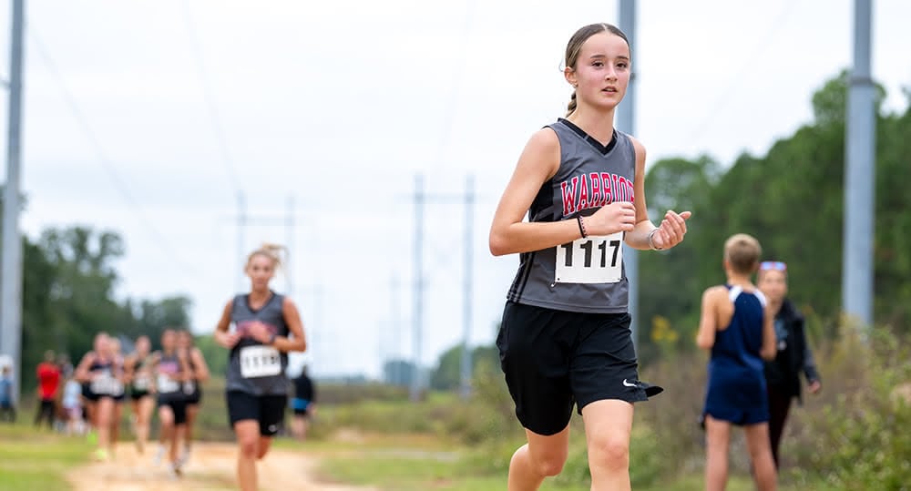 Lady Warrior Cross Country runner