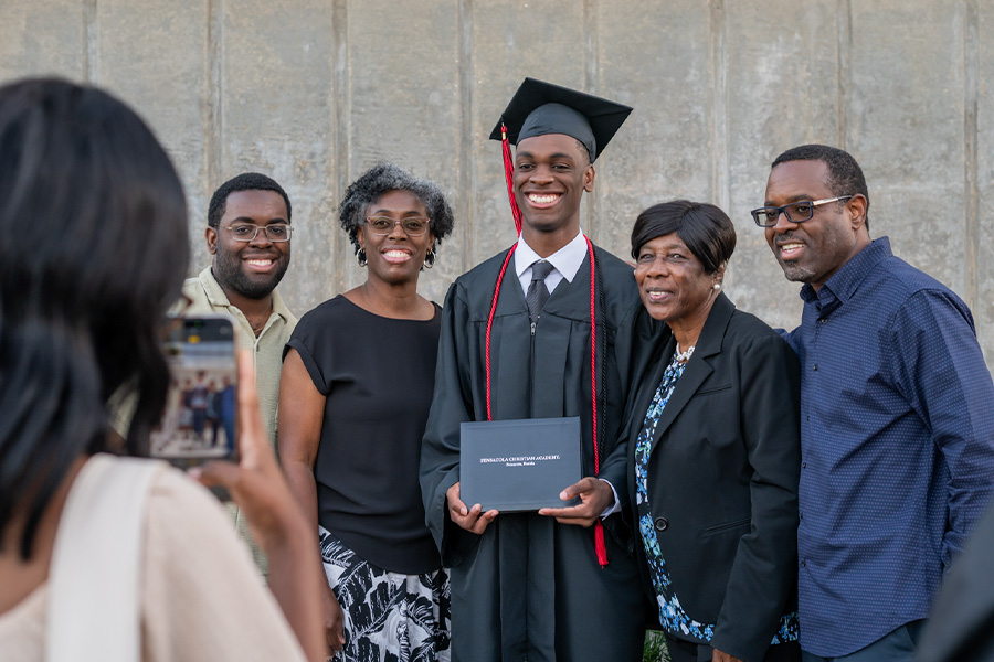 Family taking photo with graduate