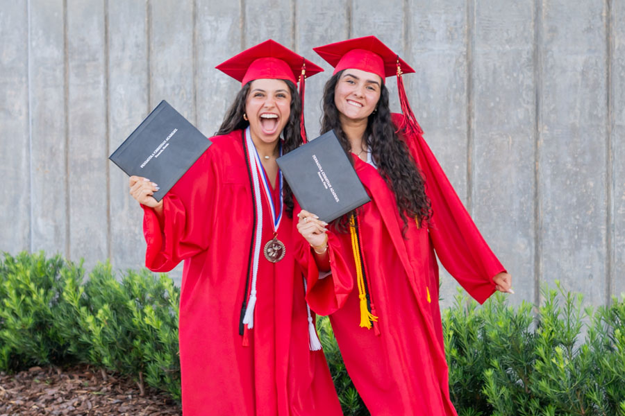 Graduates with diplomas