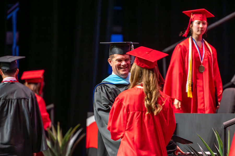 Graduate shaking hands with Dr. Birx