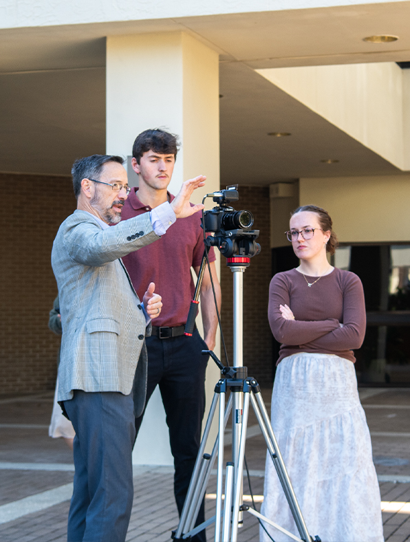 Teacher showing students camera features