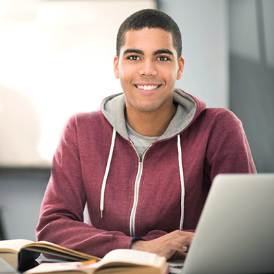 Guy studying on laptop