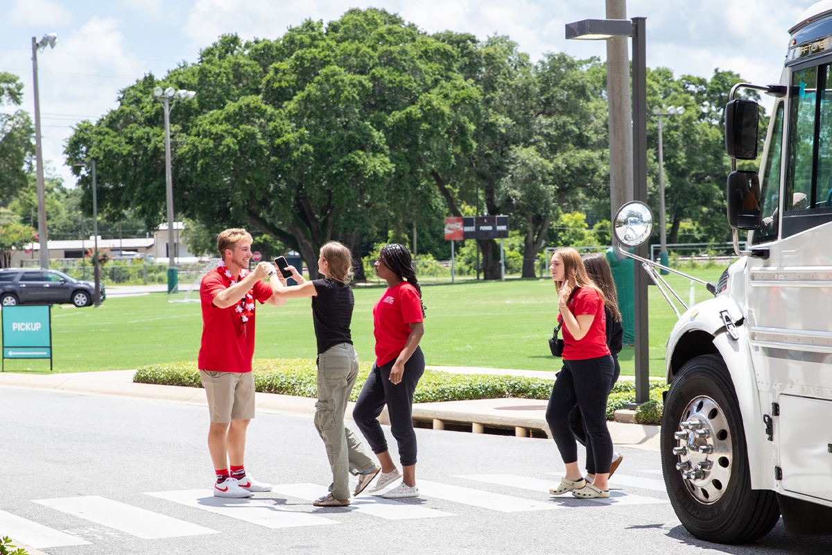 Red team camp staff greeting campers