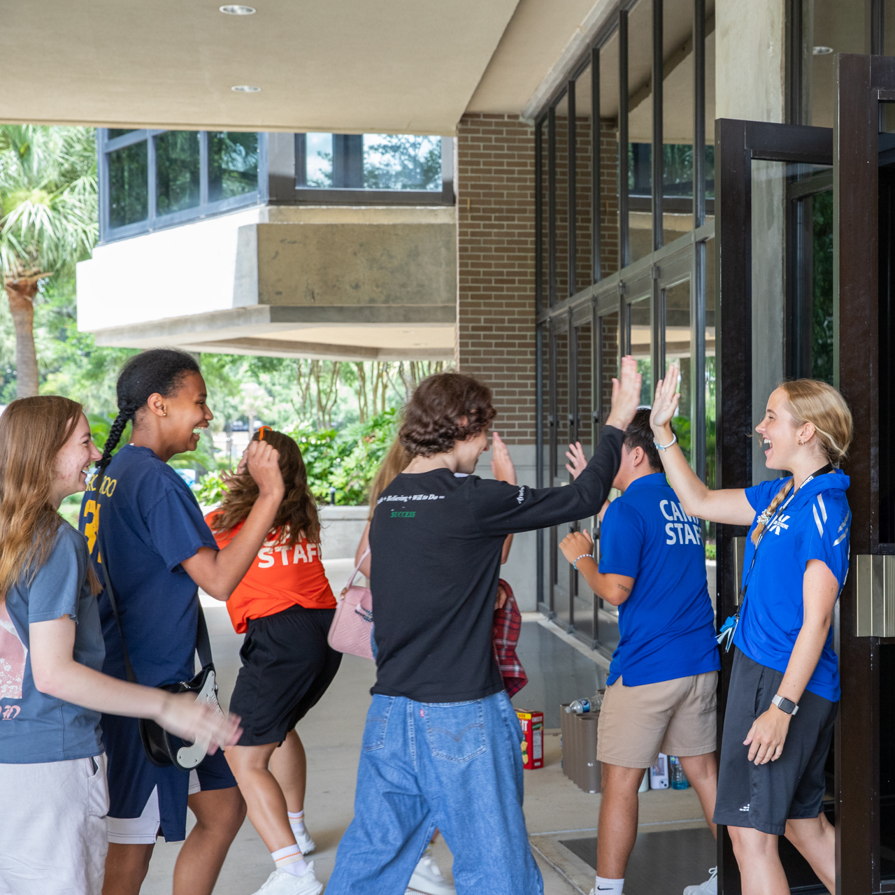 Camp Staff greeting campers