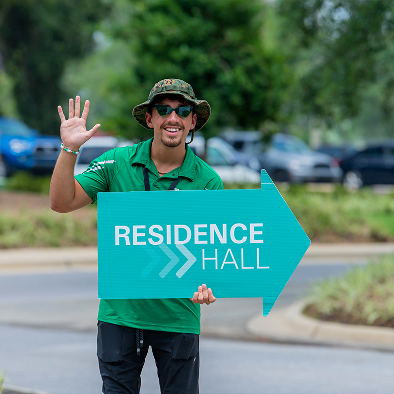 Team leader directing Campers to Residence Hall