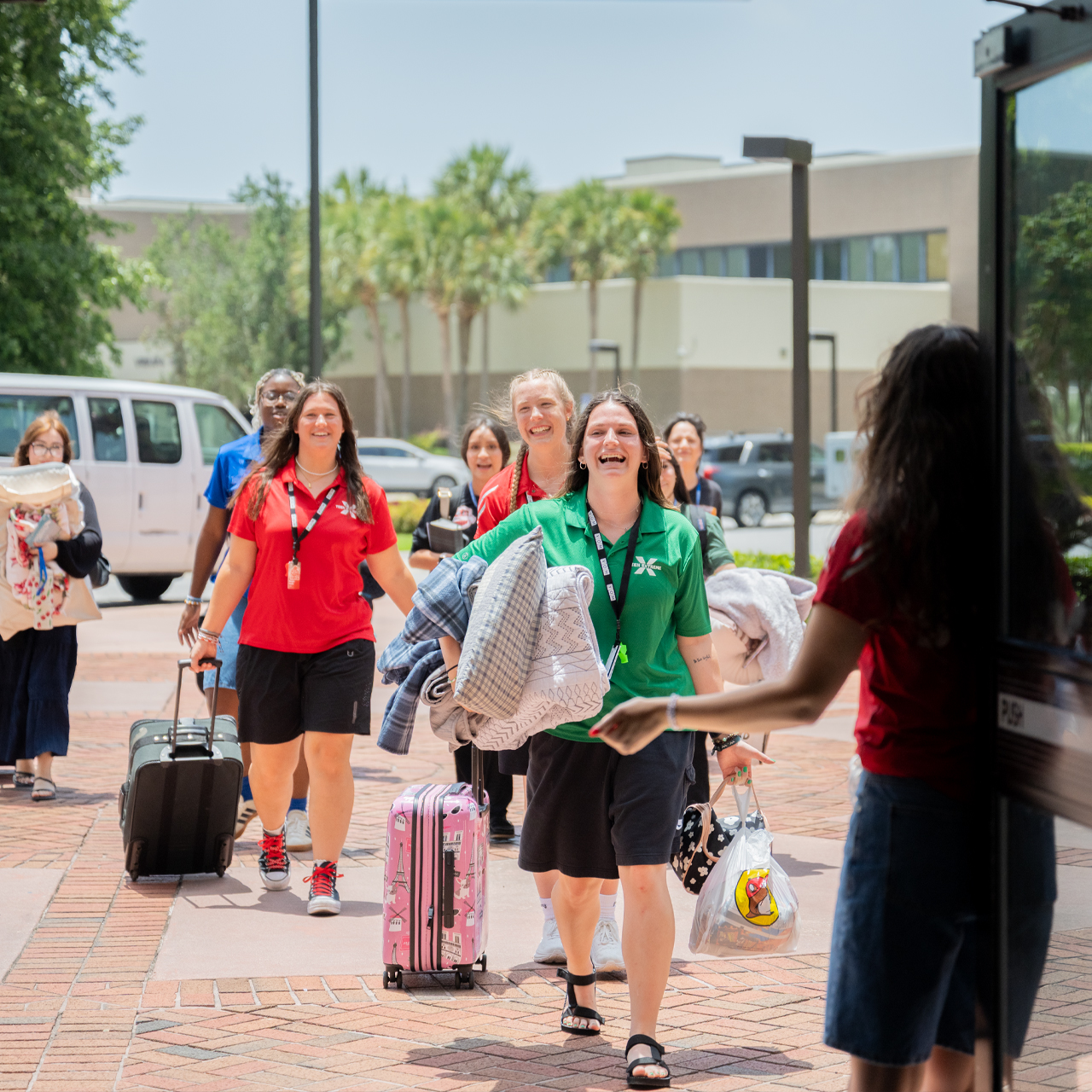 Camp staff helps campers move in