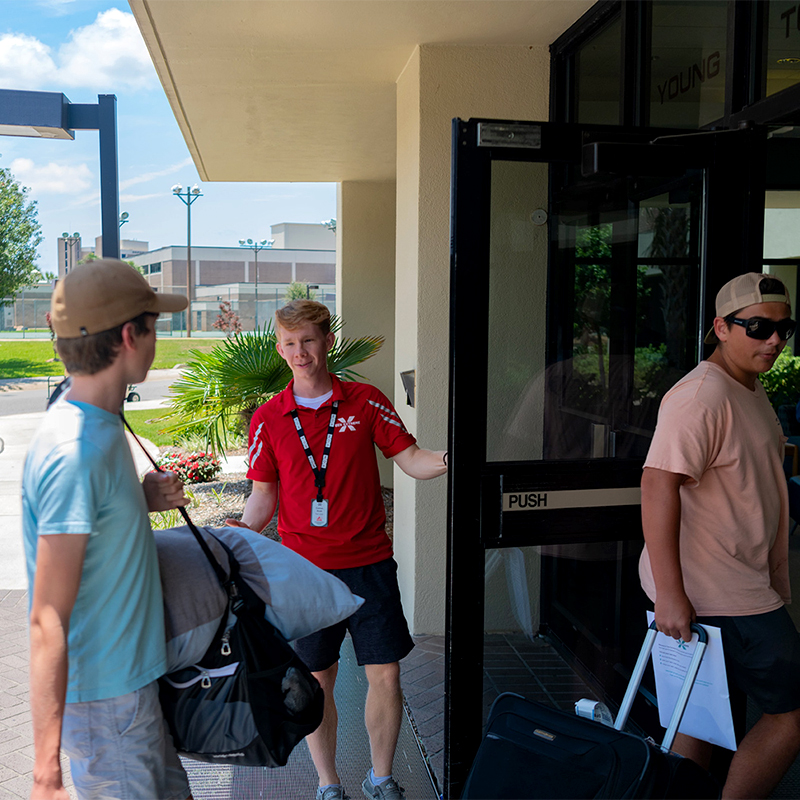 Campers moving into their residence hall