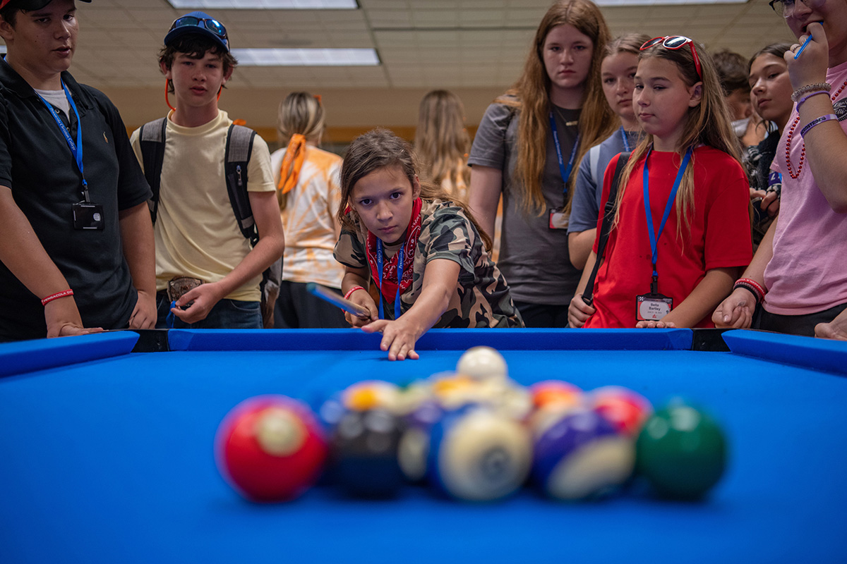 Teen Extreme campers playing pool