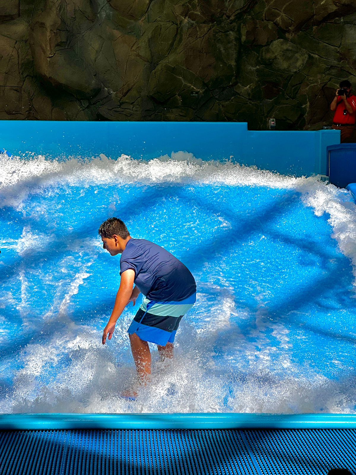 Teen Extreme camper riding the flowrider