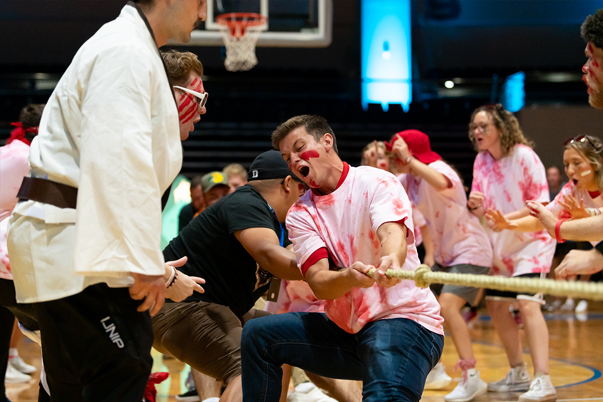 Teen Extreme red team playing tug of war