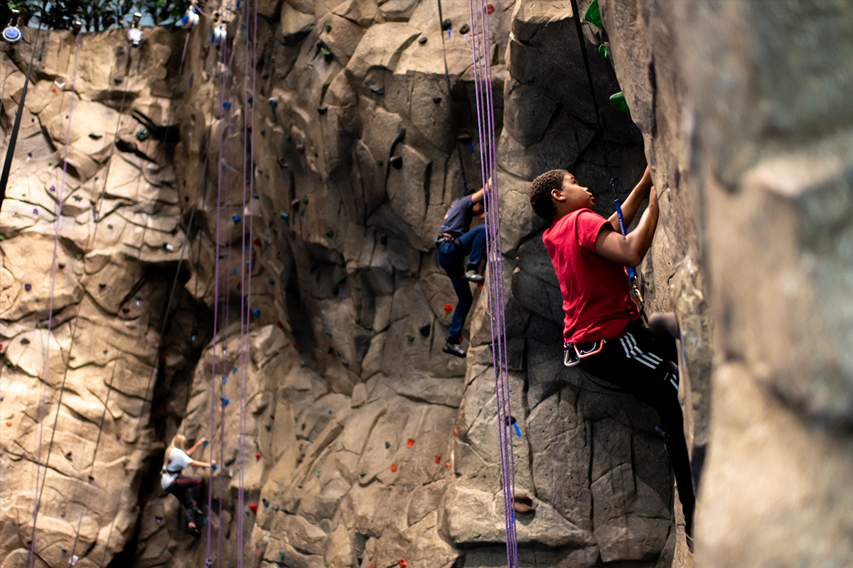 Teen Extreme Campers Rock Climbing