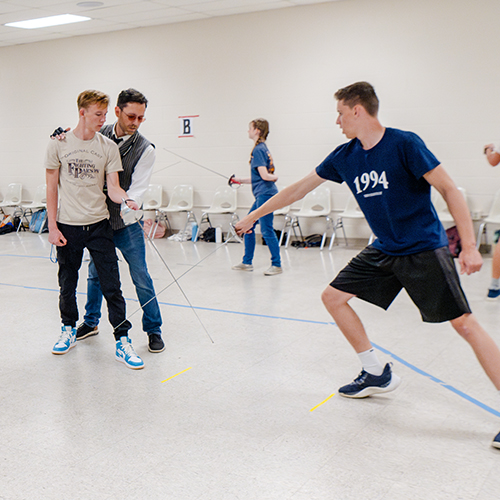 Campers learning fencing