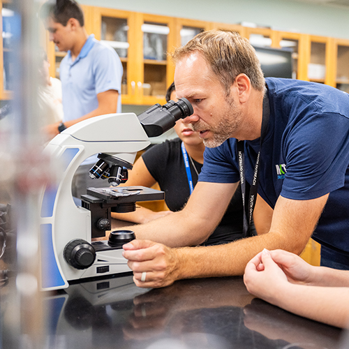 Leader and Camper observing an organ