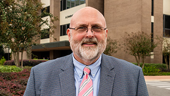 Dr. Jim White: Teaching Business and Pink Umbrellas